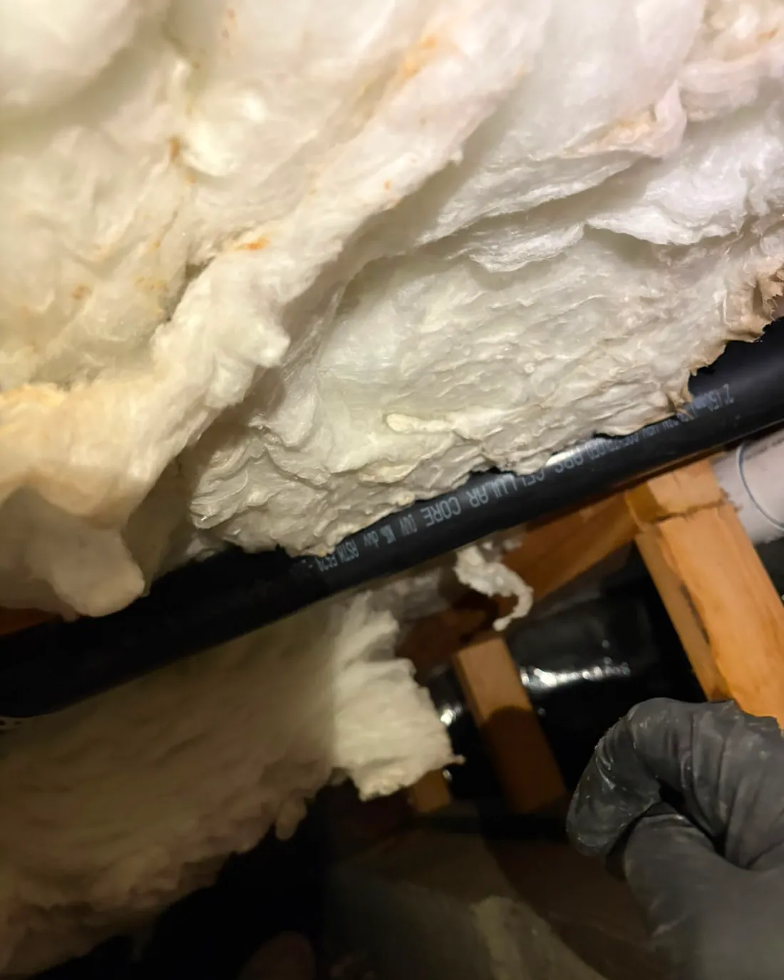 The same line tucked back inside the insulation and closed in